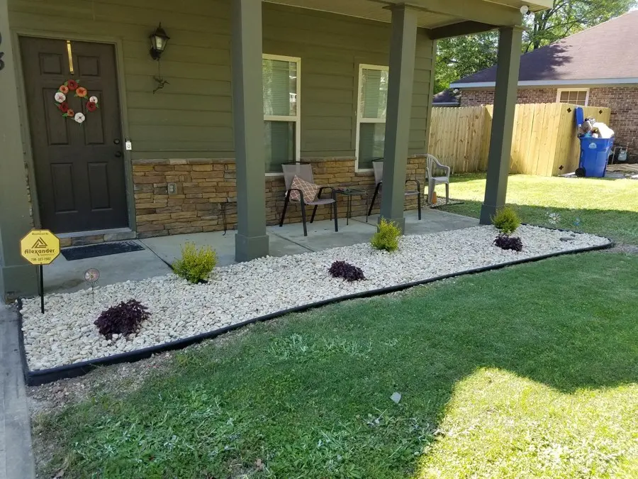 Porch bed with white gravel and plants
